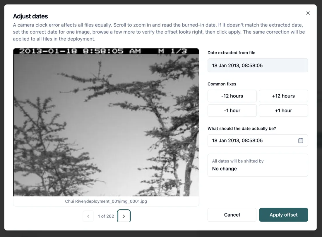 The Adjust dates window, comparing the date burned into the photo with the date read from the file